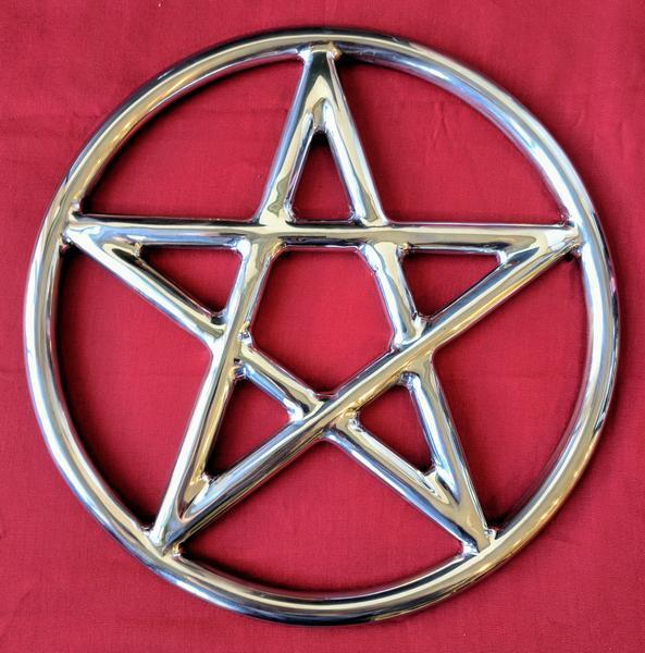 A steel suspension ring with a pentagram inside it.