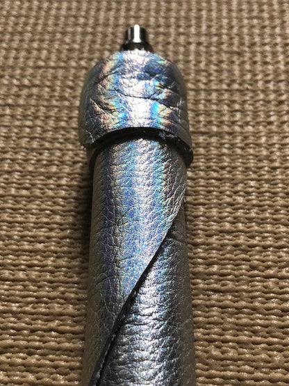 A close up of the head of the silver Unique Kink Dragon Tail Head without handle attached.
