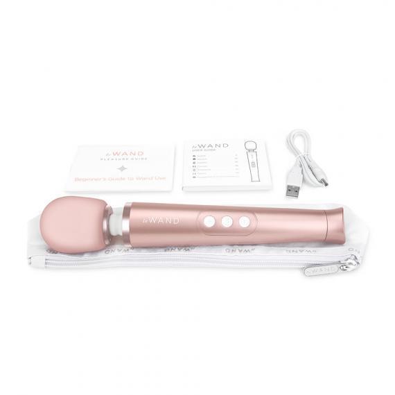 Le Wand Petite Vibrator Rose Gold with included charger, case, and instructional booklet