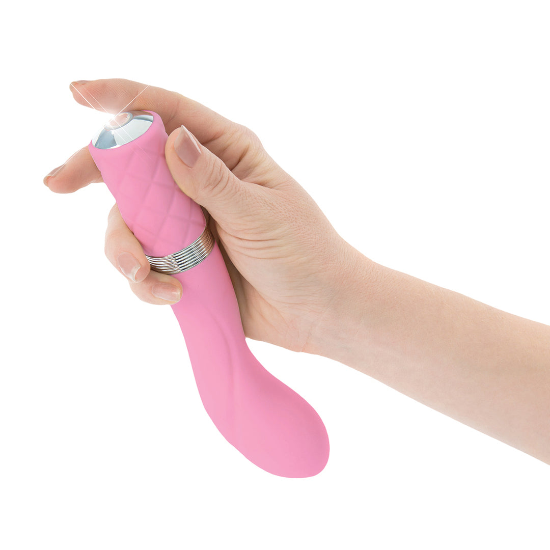 A hand showing the on/off button for the Pillow Talk Sassy G-Spot Vibrator Pink