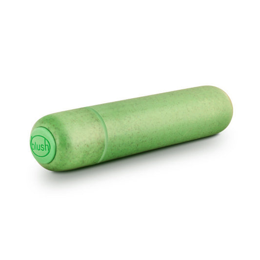 The green gaia eco bullet vibrator lying on its side, bottom button toward front.