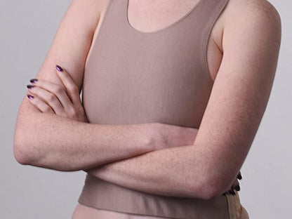 A model's torso wearing the tan BURSLF Crop Binder.