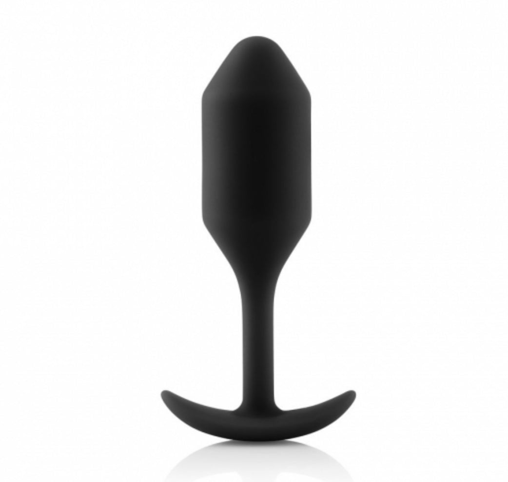 Size 2 B-Vibe Vibrating Weighted Anal Snug Plug in black standing vertically.