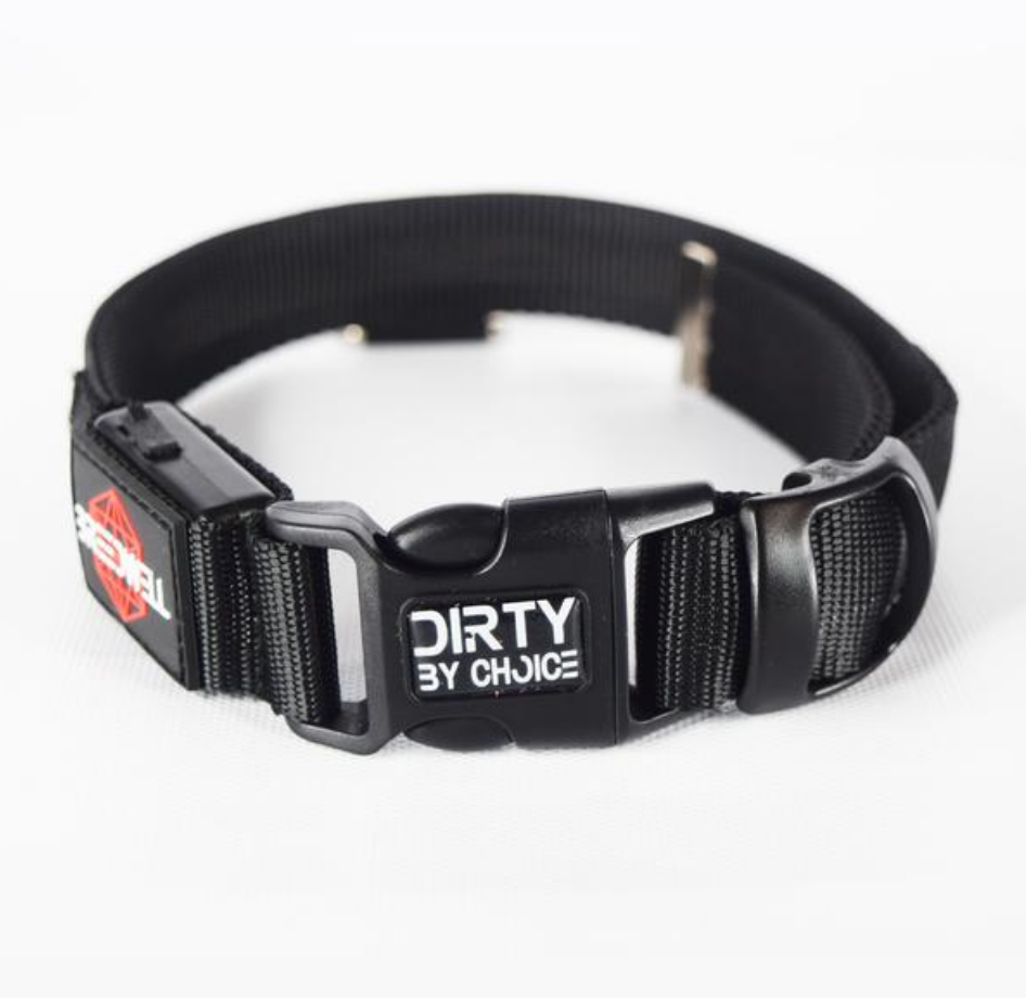 The plastic buckle for the Breedwell Pup Collar featuring the words, "Dirty by choice".