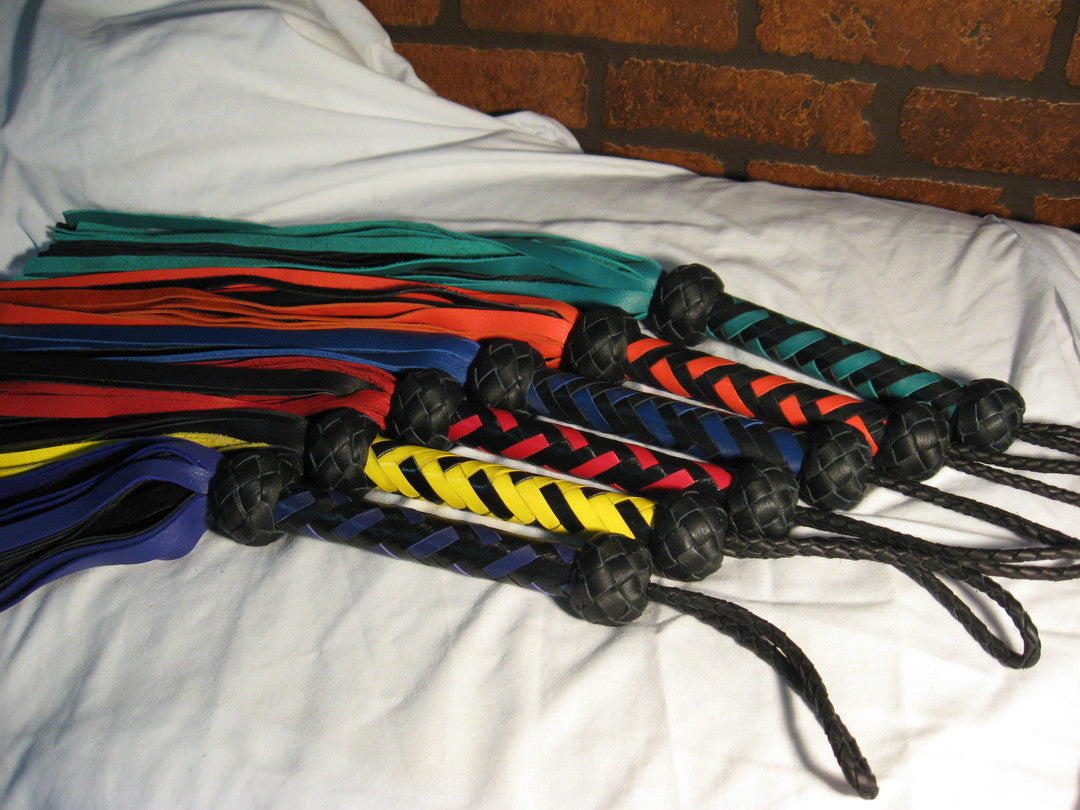 Another angle of Deertan cowhide Floggers in various colors.