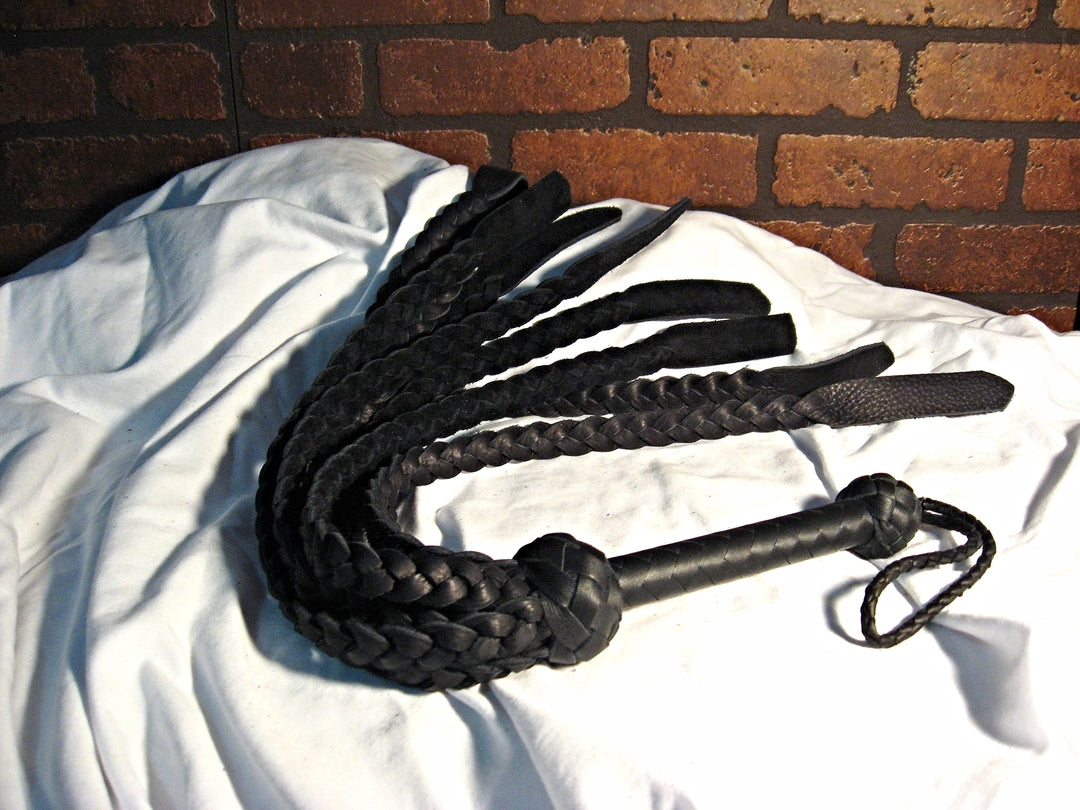 Black Buffalo Braid Flogger displayed curled up.