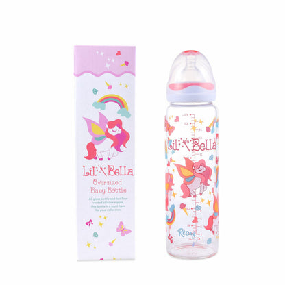 Glass Lil Bella Adult Baby Bottle sitting next to its box.