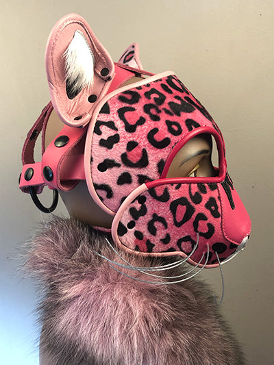 Pink Leather Big Cat mask on mannequin head with a pink and black fur scarf, right side view.