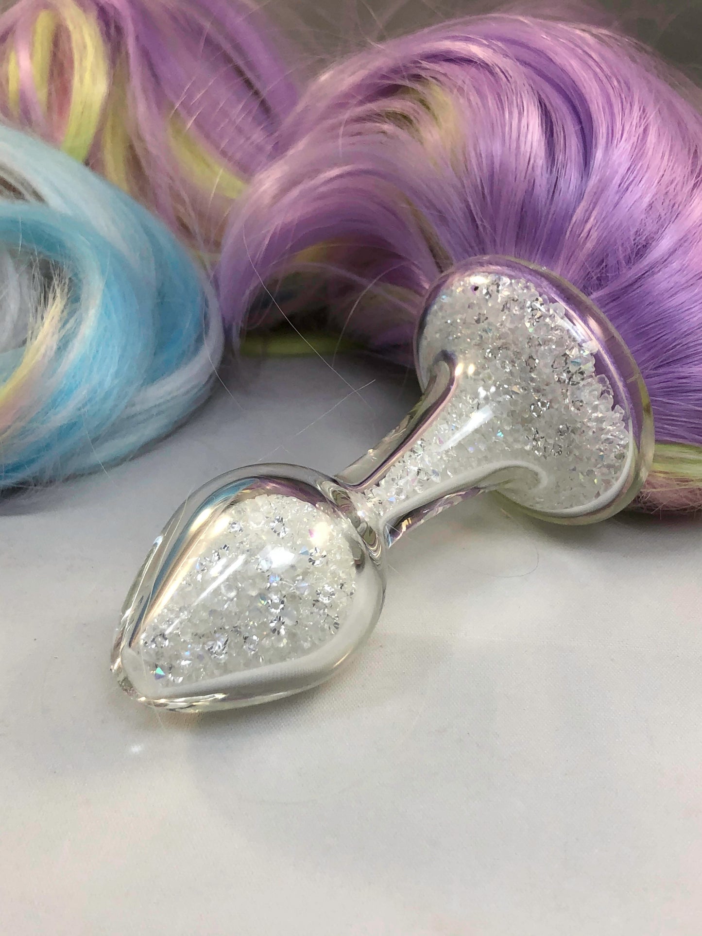 Faux pastel pony tail, close up of plug.
