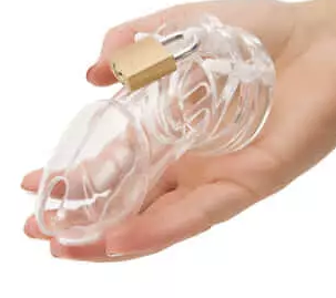 A hand holding a clear CB-6000 Chastity Device.