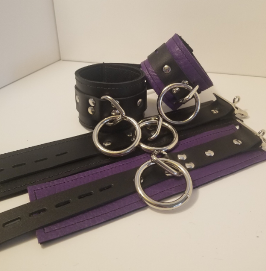 Pair of purple Basic Wrist Restraint Cuffs and a pair of black Basic Ankle Restraint Cuffs.
