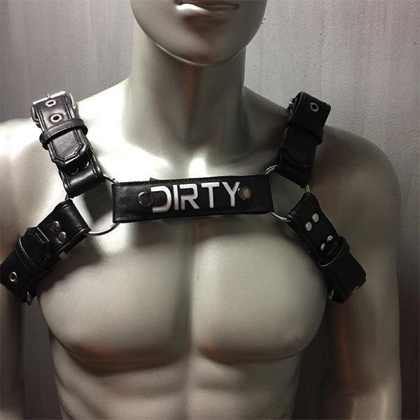 Black leather overlay 6 strap bulldog harness with removable snap center with word Dirty.