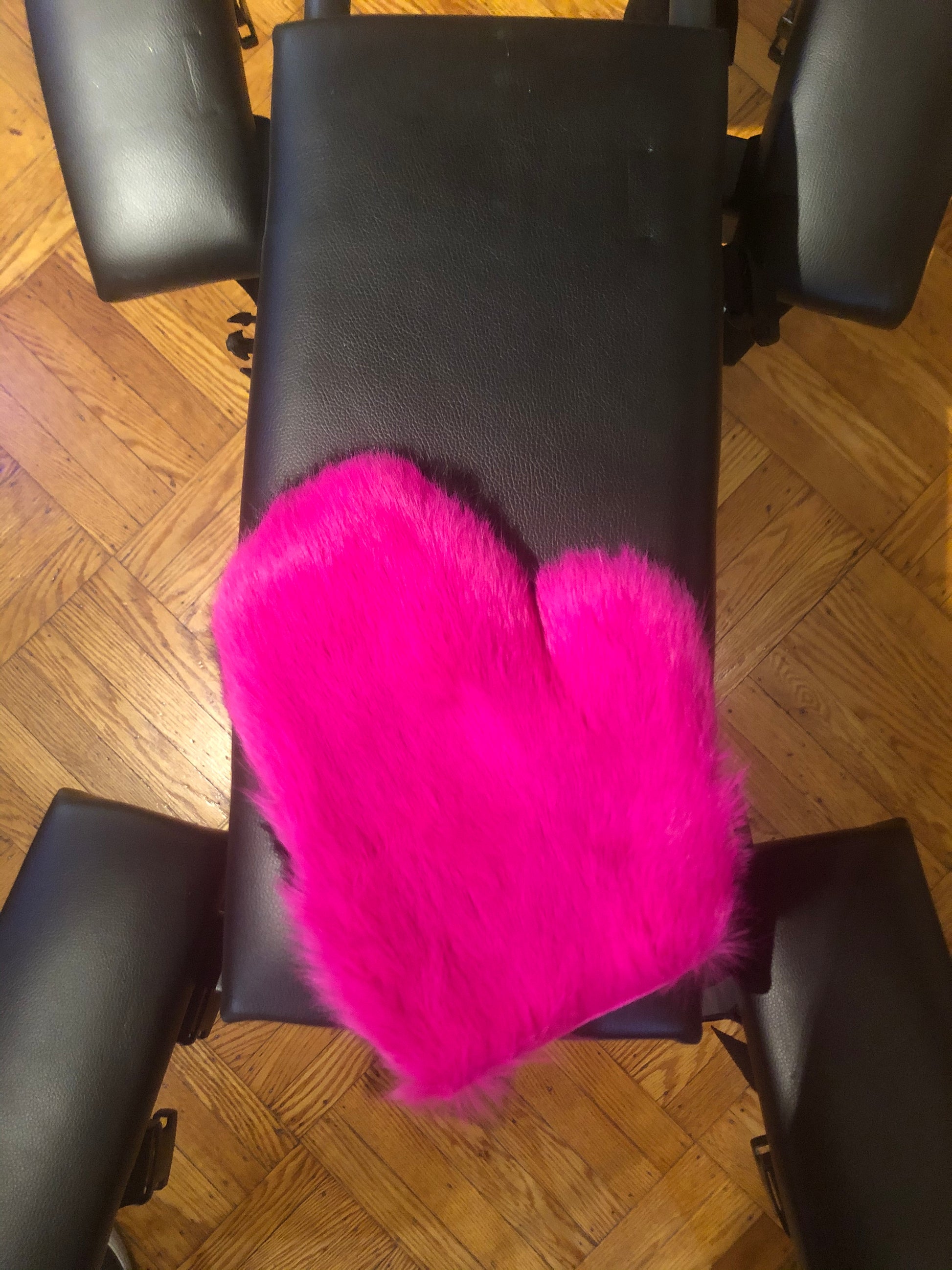Full view of pink left hand rabbit fur glove