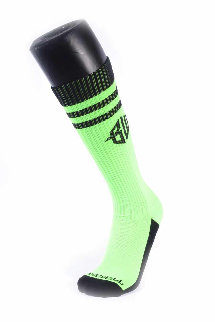 The neon green Hex Socks on a mannequin leg.