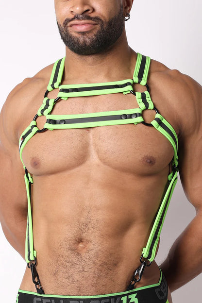 A masculine looking model showing the front of the neon green High Bar Neoprene Suspender Harness.