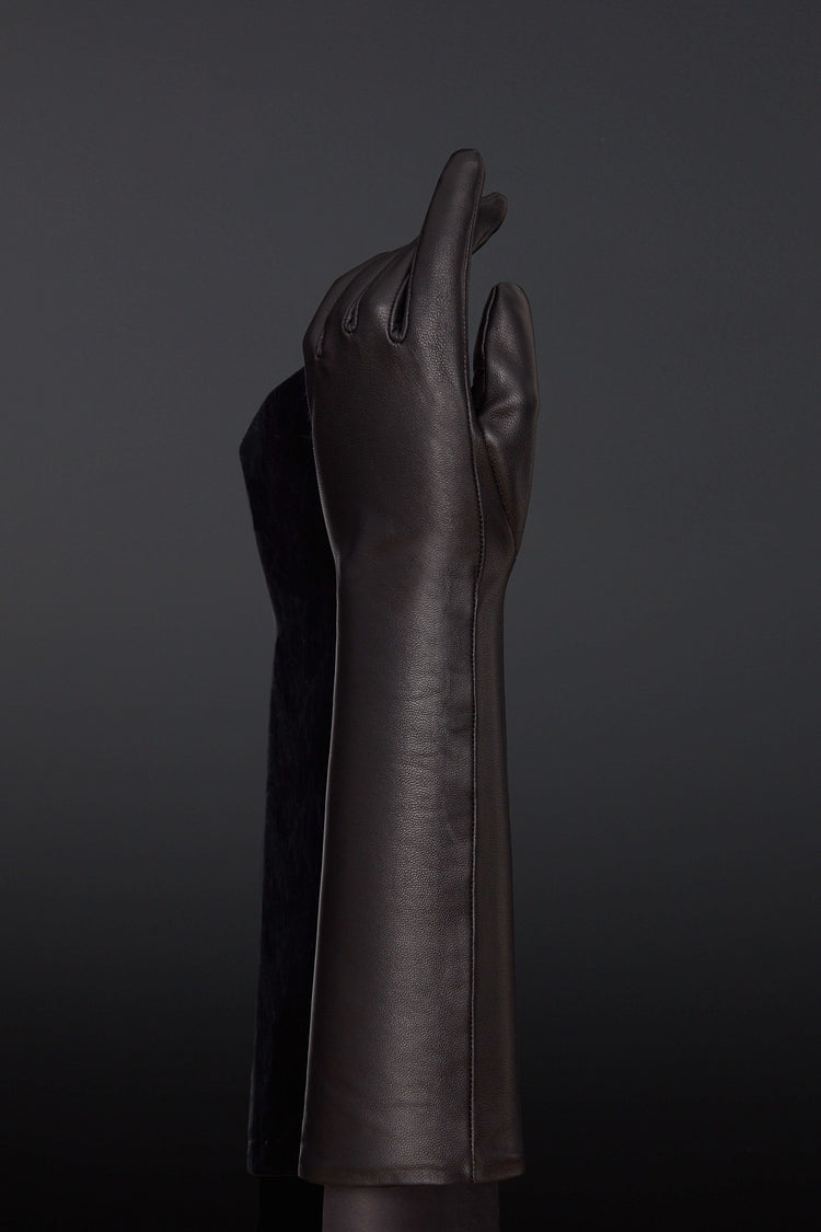 The outside of one of the Leather Forearm Gloves.