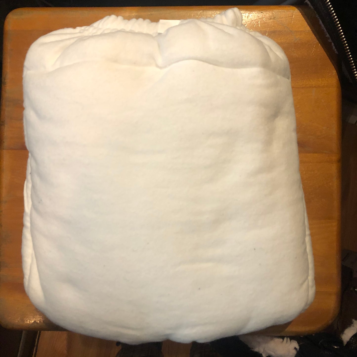The White Cloth Diaper with Velcro Closure.