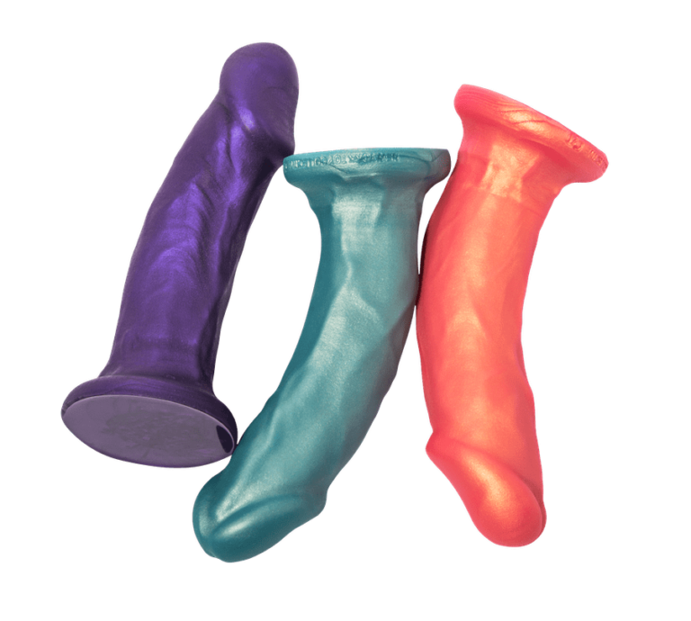 The purple, teal and rose gold Carter Pack and Play Dildos.