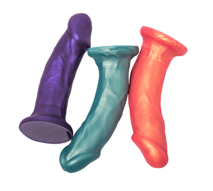 The purple, teal and rose gold Carter Pack and Play Dildos.