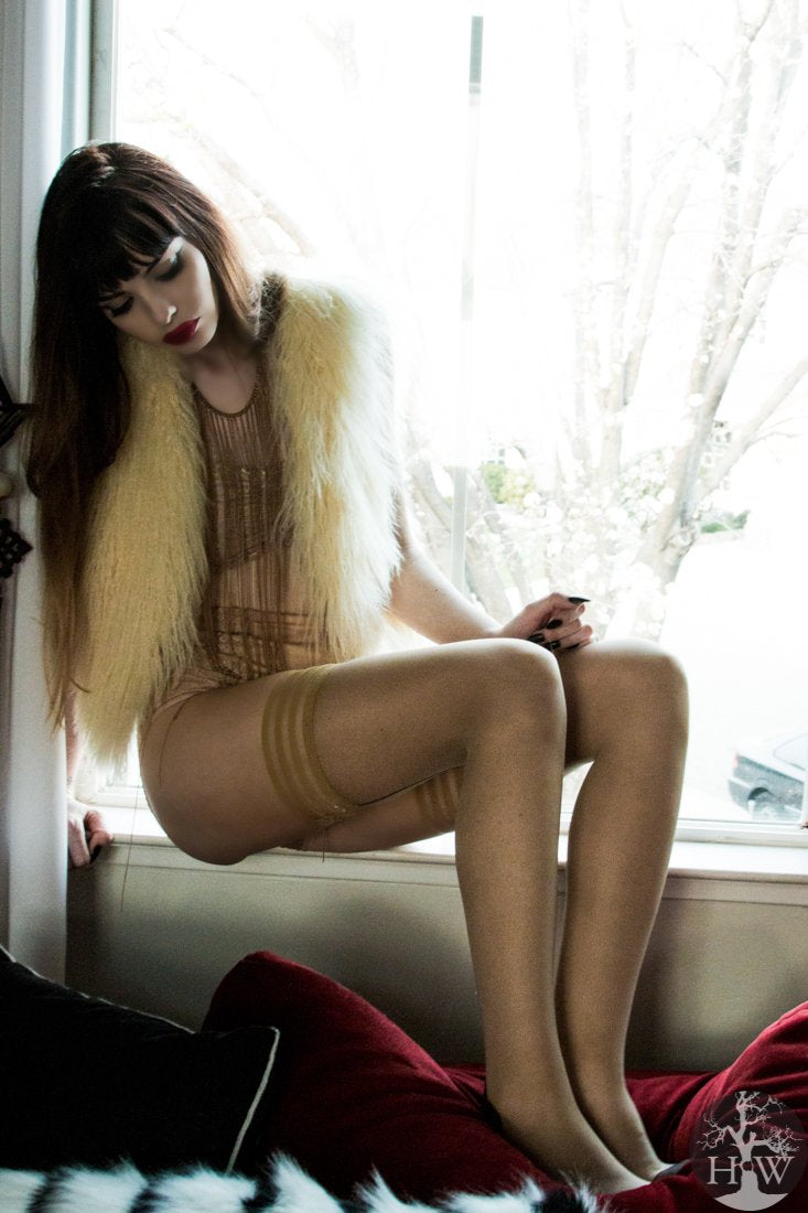 Jenny Sheer Beige Thigh Highs on seated model, right side view.