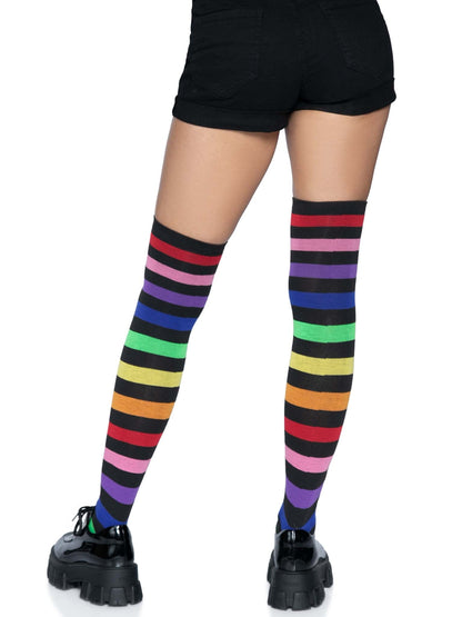 Aurora Rainbow Over The Knee Rainbow Socks on model wearing black shoes and shorts, rear view.