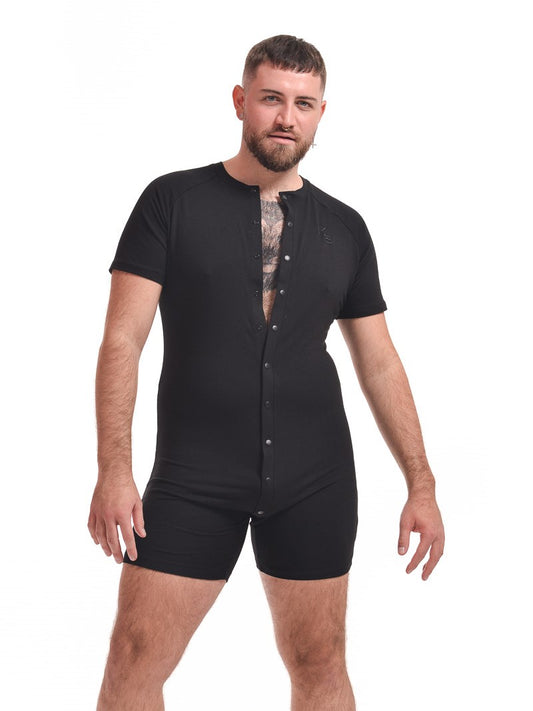 model showing the front of the black Baseball Bamboo Onesie with four snaps open.
