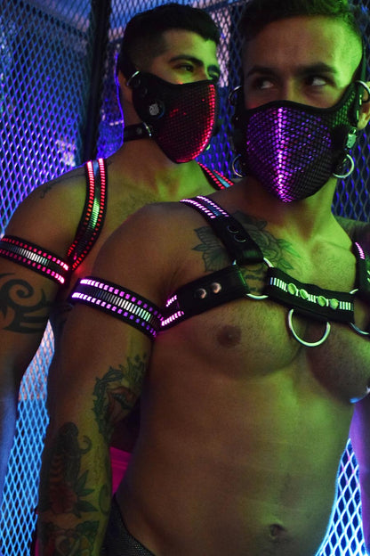 Two models wearing the mirror light armband and mirror bulldog harnesses.