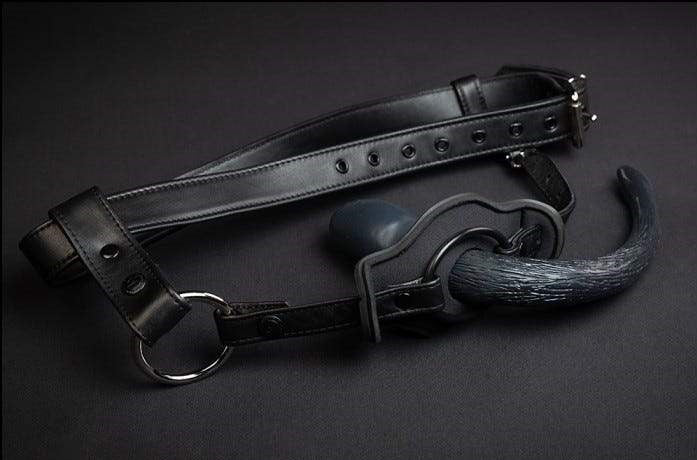 Another view of leather puppy tail holster with pup tail plug inserted