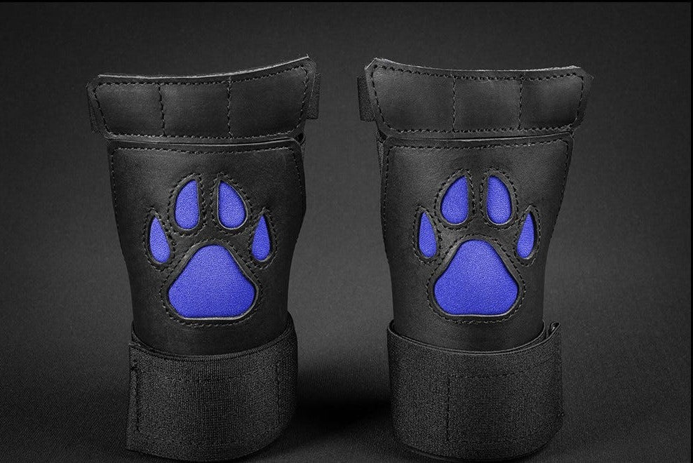 Close up of black/blue open paw puppy gloves. 