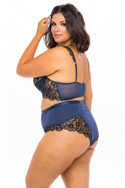 A feminine model showing the left side and back of the plus size Nicole Eyelash Bra and Panties Set.