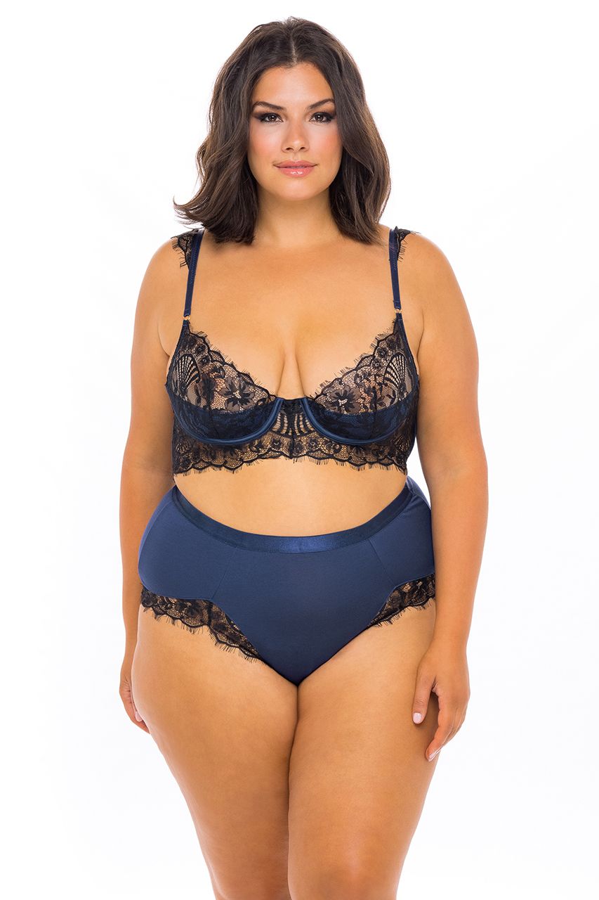 A feminine model showing the front of the plus size Nicole Eyelash Bra and Panties Set.