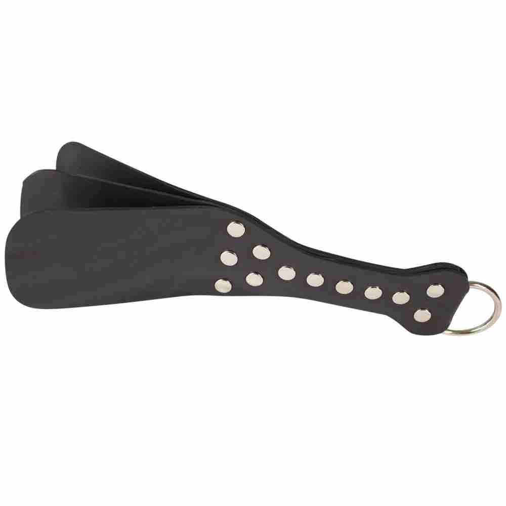 The Rubber Paddle has three layers of rubber with metal studs and a D-ring on the handle.