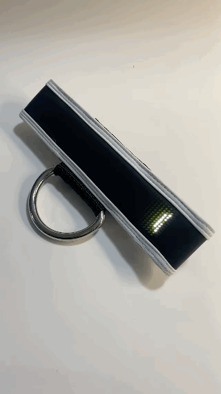 A gif of the white Marquee Programmable LED Center Strap with the words "create your own custom message" scrolling across it.
