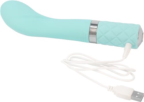 Pillow Talk Sassy G-Spot Vibrator Teal with Charger plugged in.