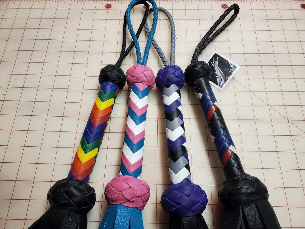 Four Medusa flogger handles with Pride Flag Color Combinations.