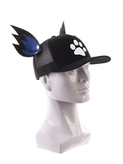 The black Puppy Paw Cap with white paw print and K-Ear Snaps.