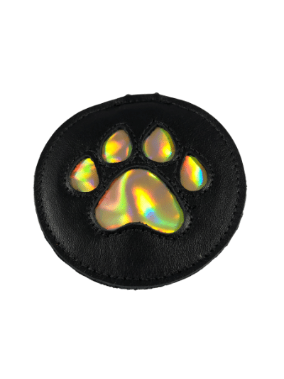 The black leather pup paw medallion with metallic gold paw design.