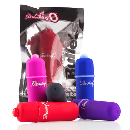 An assortment of Screaming O 3in1 Soft Touch Bullets in different colors in a pile with their packaging behind them.