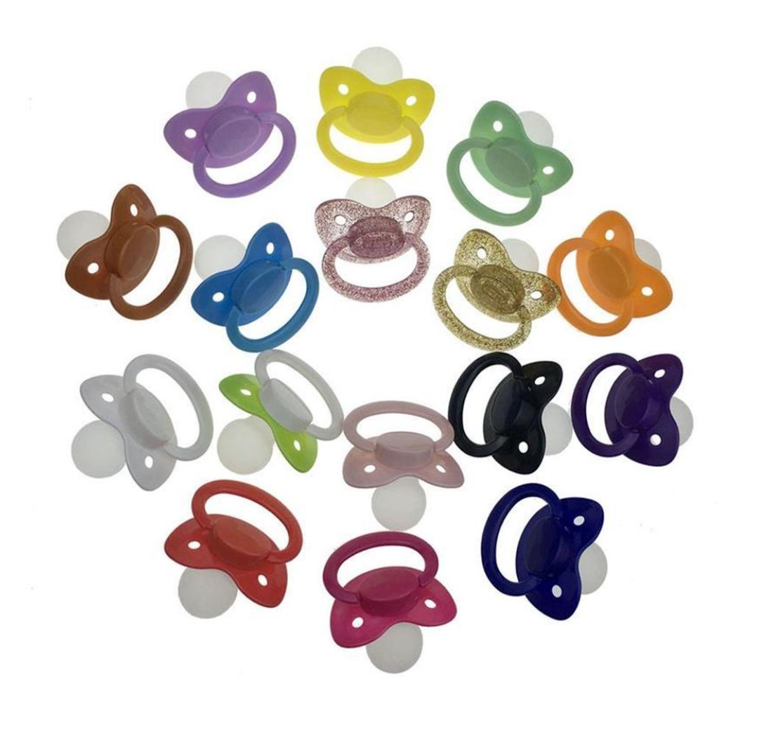 An assortment of colors of the Adult Size 6 Pacifier.