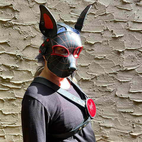 Model wearing Spider Leather Pu Mask and black leather harness with spider medallion