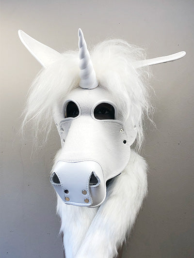 White leather unicorn mask on a mannequin, front view.
