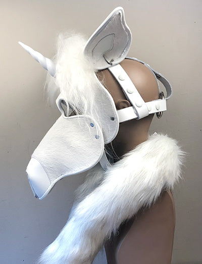 White leather unicorn mask on a mannequin, left side view.