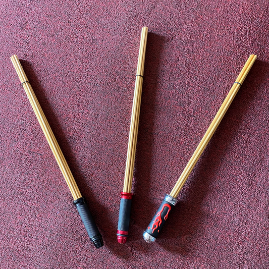 Three Dowel Cane Bundles; two plain and one with the flames handle.