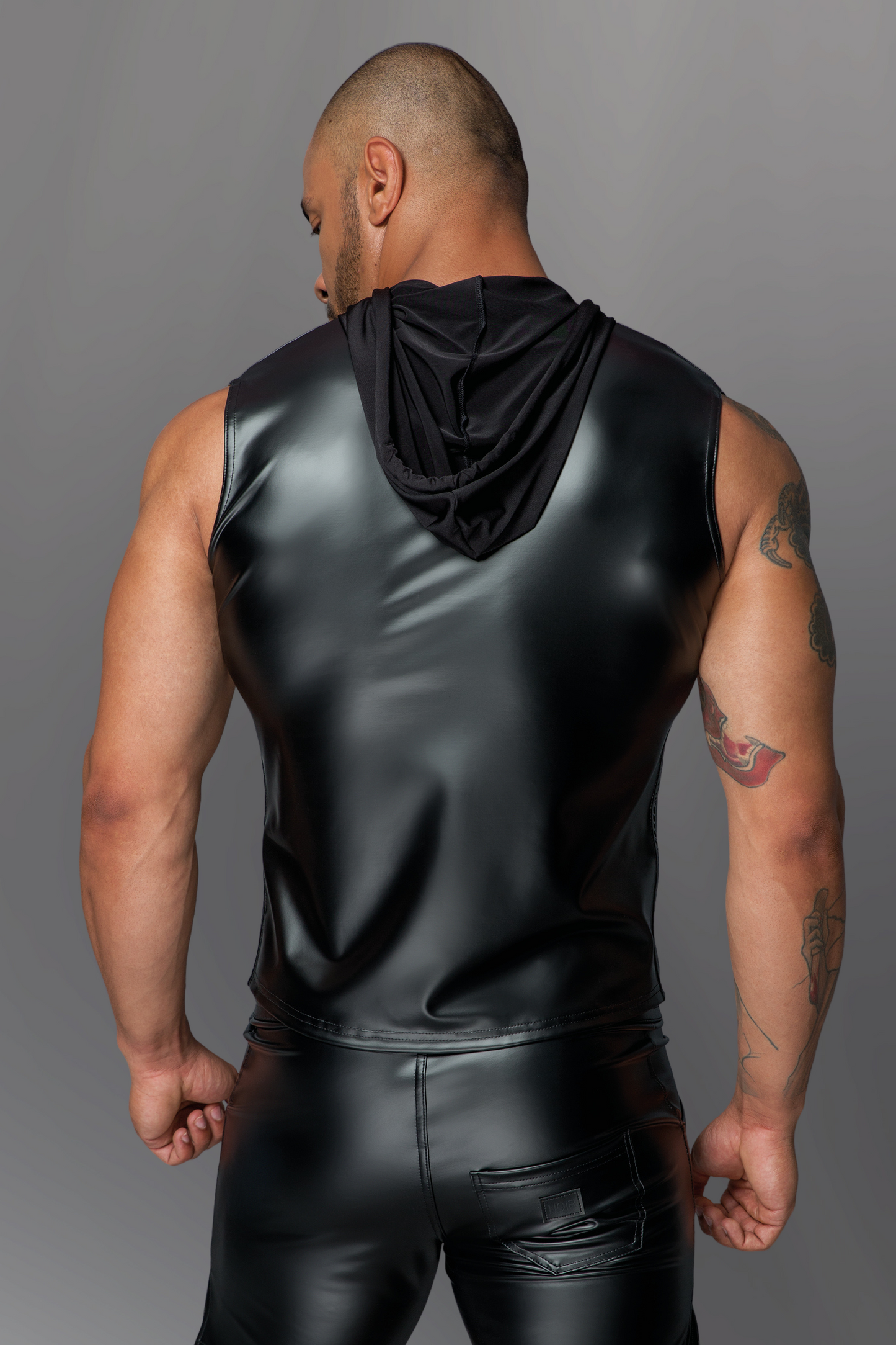 Sleeveless Hooded Wetlook Shirt on model,  rear view hood down.