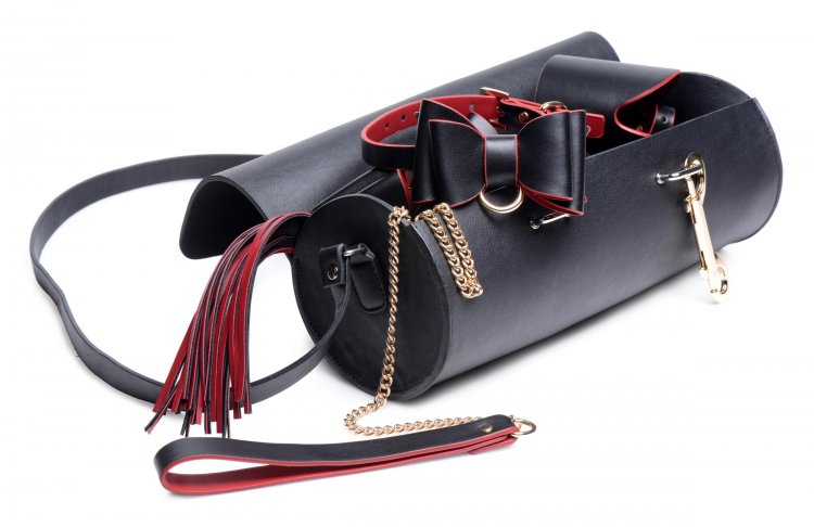 The Bow Bondage Set with Bag with its bondage gear spilling from the bag.
