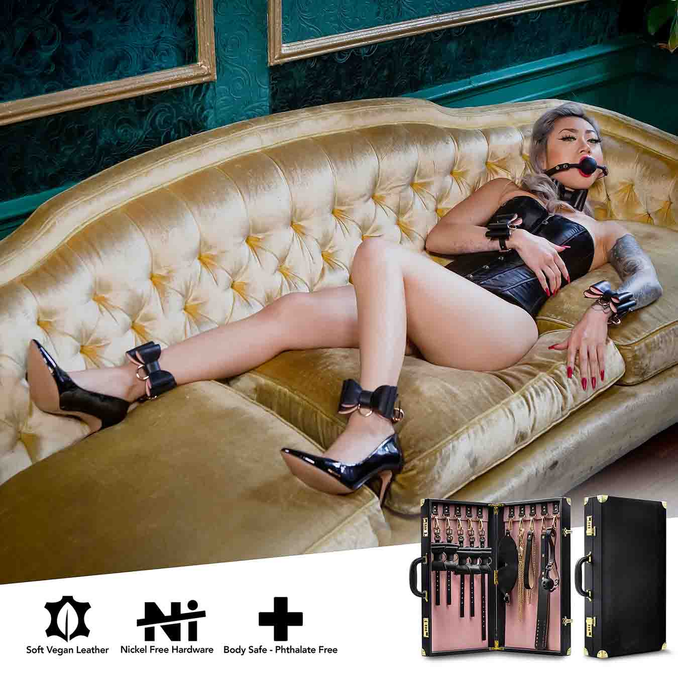 A model lying on a gold couch wearing all of the pieces of the Temptasia Safe Word Bondage Kit.