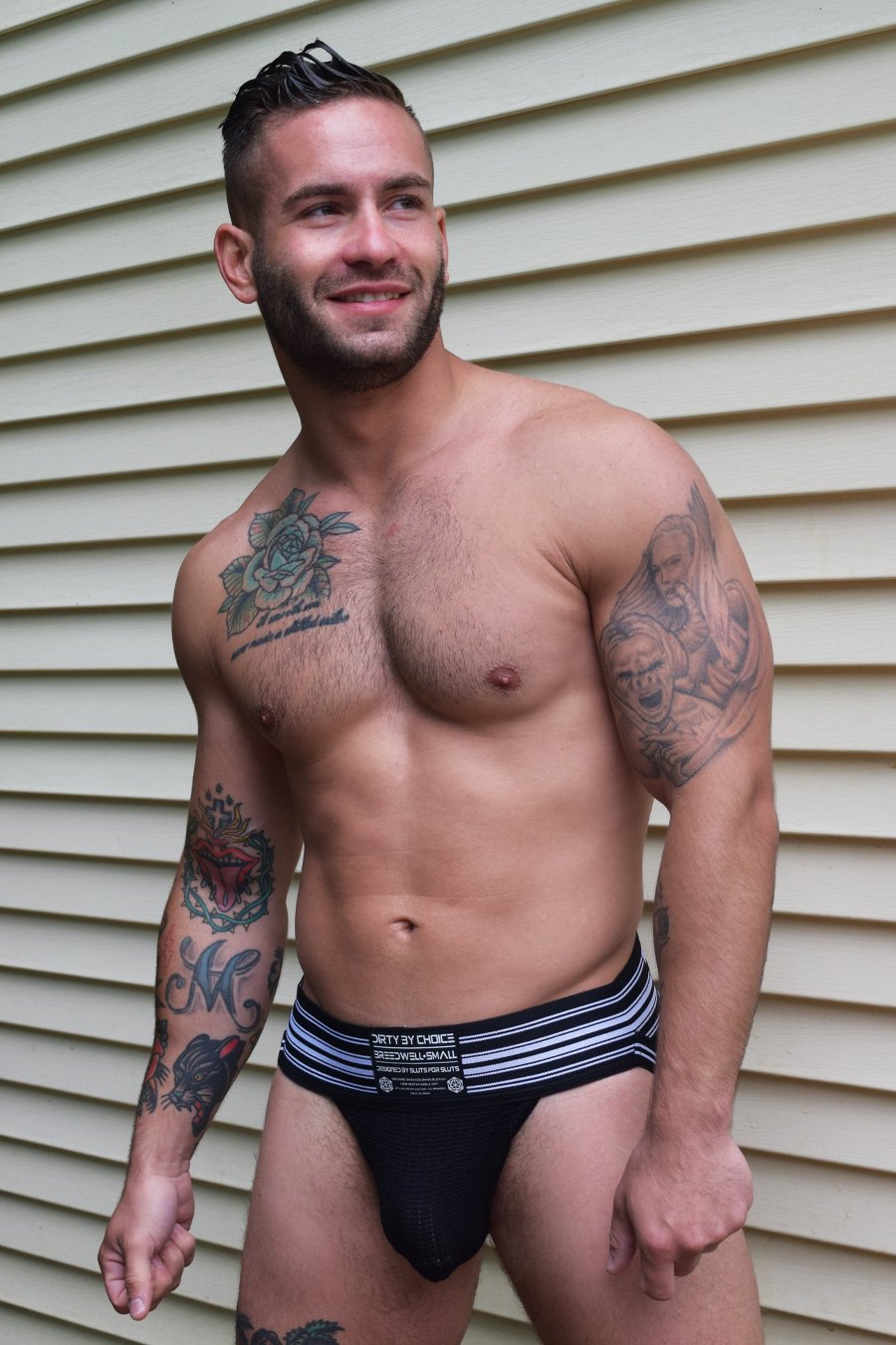 A model wearing the black CumDump Jockstrap.