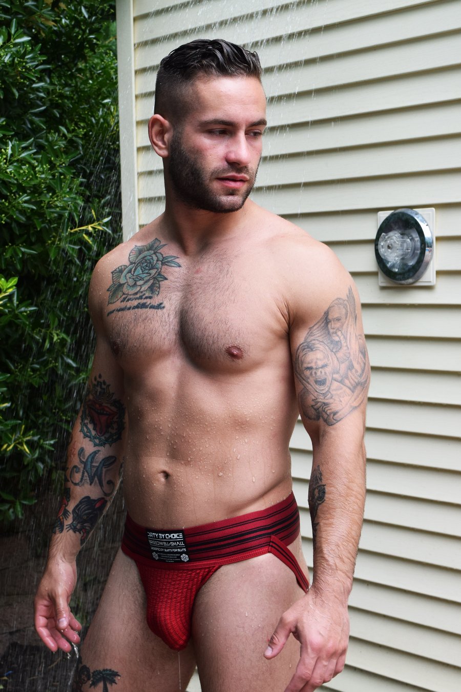 A model wearing the red CumDump Jockstrap.