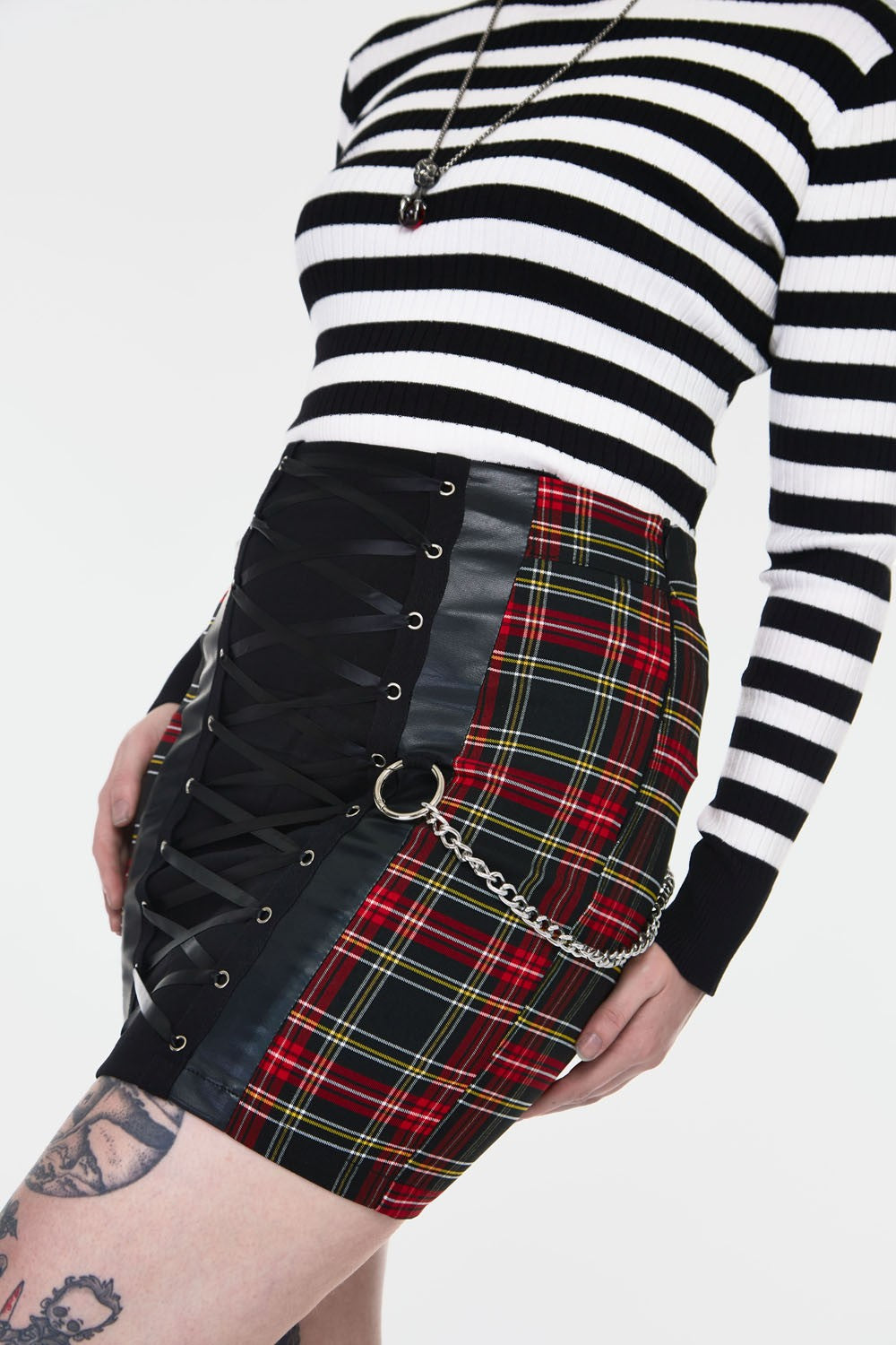 The front and left side of the Tartan Tube Skirt with Lace-Up Front Panel.