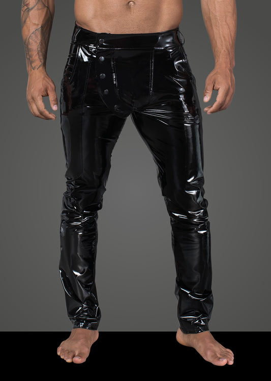A masculine model shows the front of the Vinyl Pants with Snap Fly.